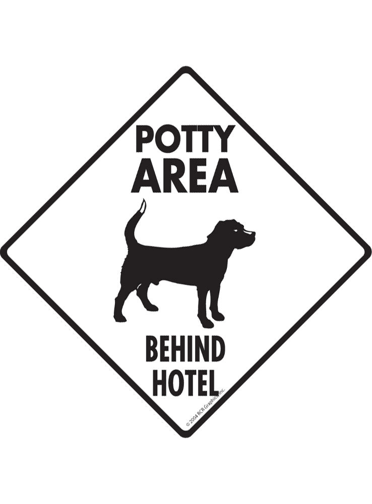 Potty Area with Dog Standing and Behind Hotel Signs or Sticker